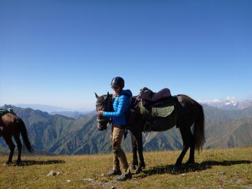 Presenter with a horse in the mountains
