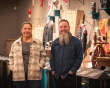 two people standing in a museum